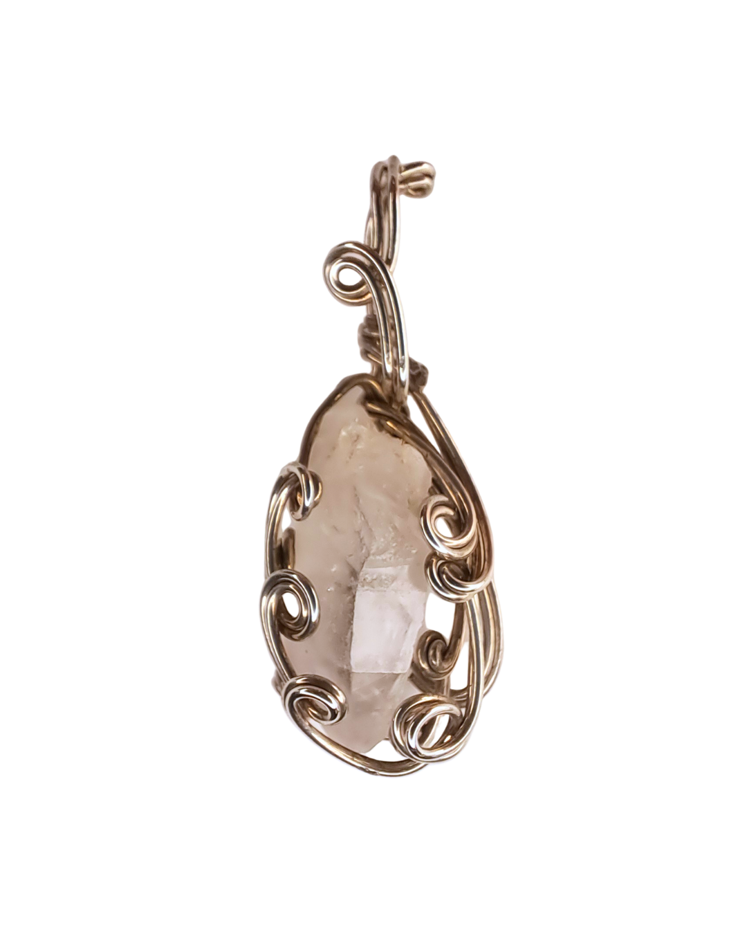 Quartz Point Scroll wire-wrapped pendant with a raw clear quartz point held in open sterling silver scrollwork